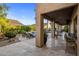 Covered patio with an outdoor kitchen overlooking a private pool area at 14518 N 99Th St, Scottsdale, AZ 85260