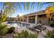 Inviting backyard oasis with a private pool and sun loungers, perfect for relaxation and entertaining at 14518 N 99Th St, Scottsdale, AZ 85260