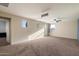 Large Activity Room featuring plush carpeting and multiple windows for natural light at 15844 W Lisbon Ln, Surprise, AZ 85379