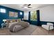 Charming bedroom with plush carpeting, modern furniture, and bright window at 15844 W Lisbon Ln, Surprise, AZ 85379