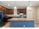 Beautiful kitchen featuring stainless steel appliances, a large island, and wooden cabinets at 15844 W Lisbon Ln, Surprise, AZ 85379