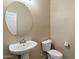 Bathroom featuring a sink and toilet at 15844 W Lisbon Ln, Surprise, AZ 85379