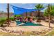 Cozy backyard seating area with shade sails and desert landscaping at 17201 E Hillcrest Dr, Fountain Hills, AZ 85268