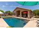 Backyard featuring a sparkling pool and outdoor seating area at 17201 E Hillcrest Dr, Fountain Hills, AZ 85268
