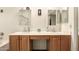 Bathroom with dual sinks, wooden cabinets, and stylish fixtures at 17201 E Hillcrest Dr, Fountain Hills, AZ 85268
