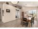 Neutral dining area showcasing decor, wood floors, and bright natural light at 17201 E Hillcrest Dr, Fountain Hills, AZ 85268