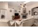 Cozy living room featuring a fireplace, high ceilings, and comfortable seating at 17201 E Hillcrest Dr, Fountain Hills, AZ 85268