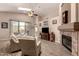 Bright living room with fireplace, vaulted ceilings, and seamless access to the backyard patio at 17201 E Hillcrest Dr, Fountain Hills, AZ 85268