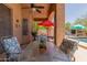 Covered patio with outdoor seating overlooking the pool area at 17201 E Hillcrest Dr, Fountain Hills, AZ 85268