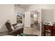Cozy sitting room with backyard views, leading into office space at 17201 E Hillcrest Dr, Fountain Hills, AZ 85268