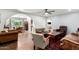 Spacious living room featuring an open floorplan, hardwood floors, and multiple seating areas for relaxation at 1743 W Acoma Dr, Phoenix, AZ 85023