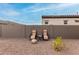 Backyard includes seating, low maintenance yard, and privacy wall at 17721 W Sandalwood Dr, Goodyear, AZ 85338