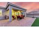 Covered patio with an outdoor table set and grill at 17721 W Sandalwood Dr, Goodyear, AZ 85338