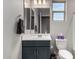 Cozy bathroom with a vanity, mirror, and toilet provides a functional and well-maintained space at 17721 W Sandalwood Dr, Goodyear, AZ 85338