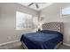 Bedroom with plush carpet, ceiling fan, and lots of light at 17721 W Sandalwood Dr, Goodyear, AZ 85338