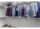 Walk-in closet featuring a rack with plenty of hanging clothes at 17721 W Sandalwood Dr, Goodyear, AZ 85338