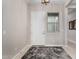 Inviting entryway features a stylish rug, white door, and complementary paint scheme at 17721 W Sandalwood Dr, Goodyear, AZ 85338