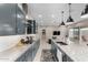 Open concept kitchen with granite counters, stainless appliances, kitchen island, and an eat-in area at 17721 W Sandalwood Dr, Goodyear, AZ 85338
