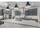 Spacious kitchen with a large island, modern appliances, granite counters, and ample cabinet space at 17721 W Sandalwood Dr, Goodyear, AZ 85338