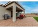 Covered patio features a BBQ grill, table with chairs, and lounging seating at 17721 W Sandalwood Dr, Goodyear, AZ 85338