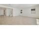 Spacious living room with tile floors and lots of natural light at 19015 W Rose Ln, Waddell, AZ 85355