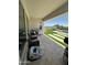 Covered back patio and outdoor kitchen area with a view of the pool at 19929 W Marshall Ave, Litchfield Park, AZ 85340