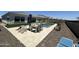 Backyard patio area with artificial grass and an inground pool with desert landscaping at 19929 W Marshall Ave, Litchfield Park, AZ 85340