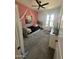 bedroom with an Eiffel Tower themed print and a swinging chair near a window providing plenty of sunlight at 19929 W Marshall Ave, Litchfield Park, AZ 85340