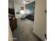 Charming Bedroom room with crib, gray carpet, and chair with ottoman at 19929 W Marshall Ave, Litchfield Park, AZ 85340