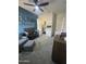 Well-lit Bedroom showcases blue accent wall, crib, walk-in closet, chair and ottoman at 19929 W Marshall Ave, Litchfield Park, AZ 85340