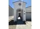 Inviting walkway leading to front door with arched entry at 19929 W Marshall Ave, Litchfield Park, AZ 85340