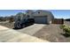 Charming single-story home featuring low-maintenance landscaping, a two-car garage, and stone accents at 19929 W Marshall Ave, Litchfield Park, AZ 85340