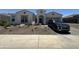 Beautiful single-story home with xeriscape landscaping, a welcoming entryway, and a modern design at 19929 W Marshall Ave, Litchfield Park, AZ 85340