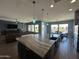 Open kitchen and living room area with a large island and hardwood floors at 19929 W Marshall Ave, Litchfield Park, AZ 85340