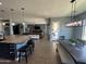 Kitchen and dining area view with decorative lights and a large kitchen island at 19929 W Marshall Ave, Litchfield Park, AZ 85340