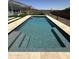 Backyard inground pool with desert landscaping around the perimeter at 19929 W Marshall Ave, Litchfield Park, AZ 85340