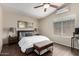 Bedroom with a desk, ceiling fan, and tiled floors, bathed in natural light at 20044 N 30Th Pl, Phoenix, AZ 85050