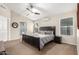 Spacious bedroom with a ceiling fan, natural light, and a modern ensuite bathroom at 20044 N 30Th Pl, Phoenix, AZ 85050