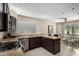 Modern kitchen featuring granite countertops, stainless steel appliances, and tile floors at 20044 N 30Th Pl, Phoenix, AZ 85050