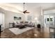 Bright living room with a fireplace, ceiling fan, and lots of natural light at 20044 N 30Th Pl, Phoenix, AZ 85050