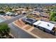 Aerial view of neighborhood showcasing home's new solar panels and the quiet surrounding streets at 2204 E Birchwood Ave, Mesa, AZ 85204
