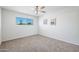 Clean bedroom with plush carpeting, natural light from the window and Paris-themed wall art at 2204 E Birchwood Ave, Mesa, AZ 85204