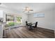 Dining area featuring wood flooring and sliding glass doors to the backyard at 2204 E Birchwood Ave, Mesa, AZ 85204