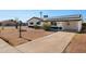 Inviting single-story home with a private driveway, offering both convenience and curb appeal in a friendly neighborhood at 2204 E Birchwood Ave, Mesa, AZ 85204