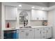 Refreshed kitchen featuring white cabinets and sleek countertops, creating a clean and modern space perfect for cooking and storage at 2204 E Birchwood Ave, Mesa, AZ 85204