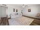Bright living room with hardwood floors, a ceiling fan, and neutral paint, creating a versatile and welcoming space at 2204 E Birchwood Ave, Mesa, AZ 85204