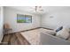 Well-lit living room boasts hardwood floors and a large window, creating an inviting space perfect for relaxation and entertaining at 2204 E Birchwood Ave, Mesa, AZ 85204