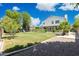 Expansive backyard featuring lush green grass, mature trees, and a playset perfect for outdoor fun at 2258 N Gentry --, Mesa, AZ 85213
