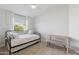 Bright bedroom with daybed, side table and bench with neutral color palette and natural light at 2258 N Gentry --, Mesa, AZ 85213