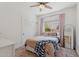 Comfortable bedroom featuring a cozy bed, sliding closet doors, and a window with soft pink curtains at 2258 N Gentry --, Mesa, AZ 85213